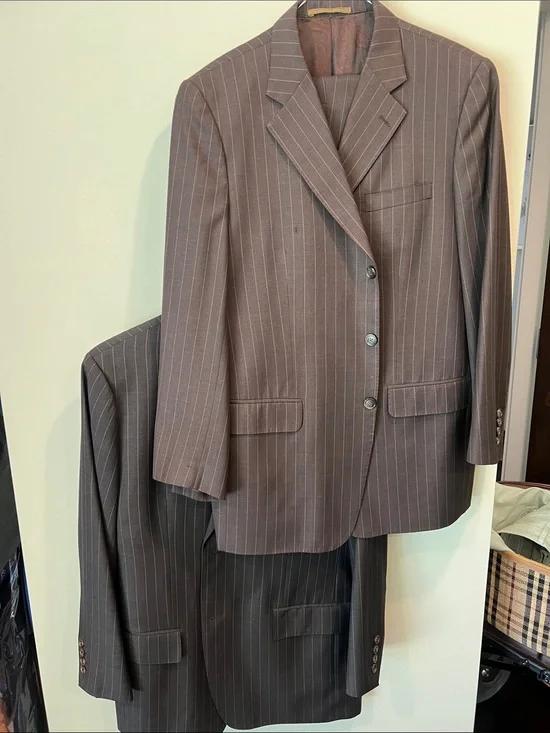 Bundle of two pin striped men’s suits.