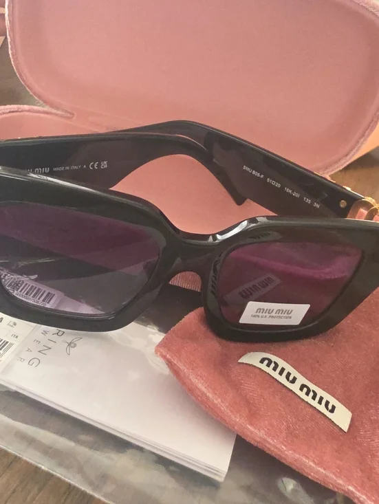 Miu Miu Glossy Black Frame Sunglasses with Purple Lenses