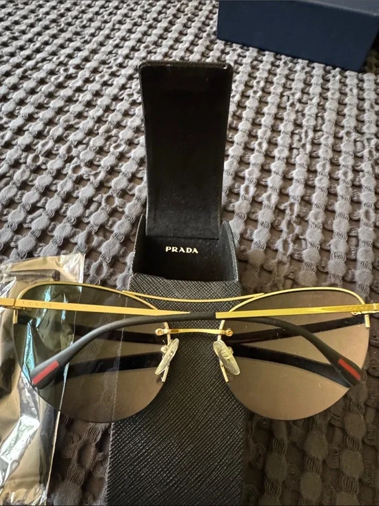 Prada Gold Frame Sunglasses with Orange-Red Mirrored Lenses