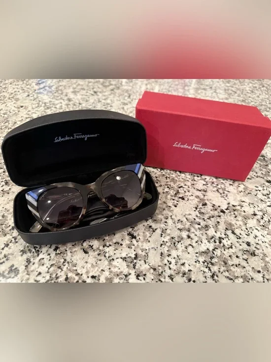 Salvatore Ferragamo Tortoiseshell Cat-Eye Sunglasses with Blue Accent.