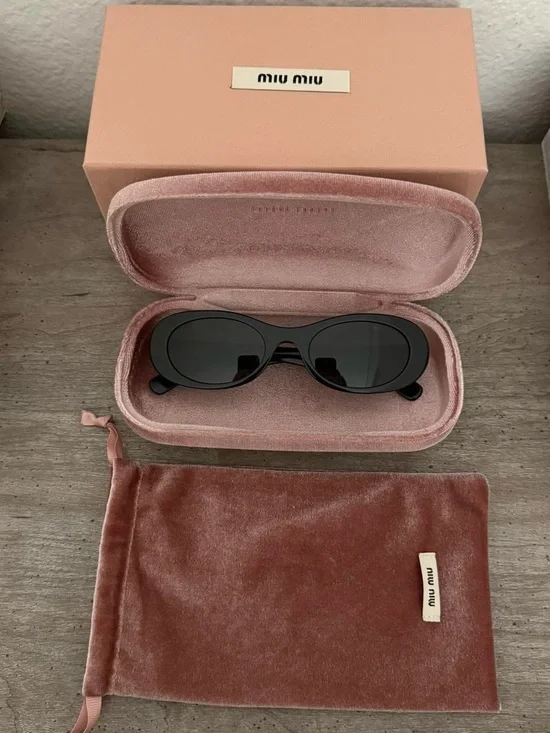 Miu Miu Black Oval Sunglasses