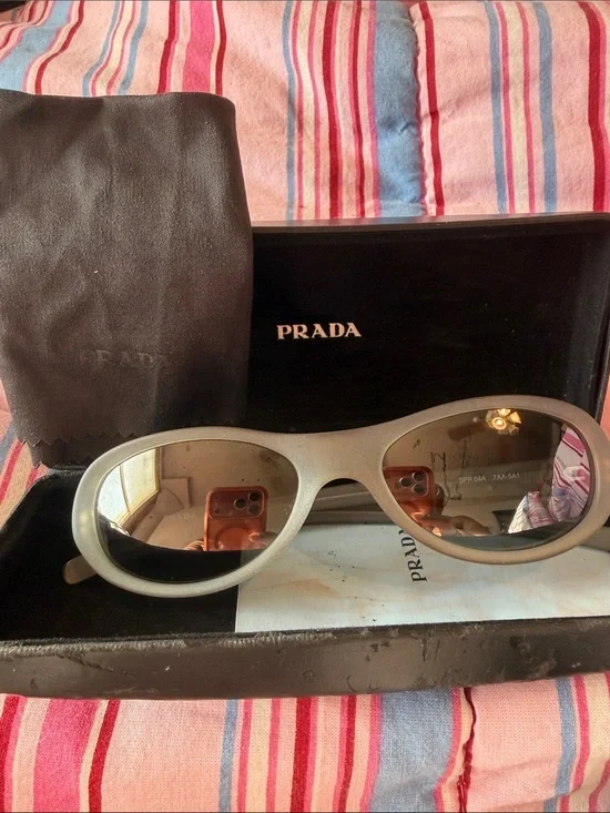 Prada Silver Oval Sunglasses with Brown-Tinted Lenses