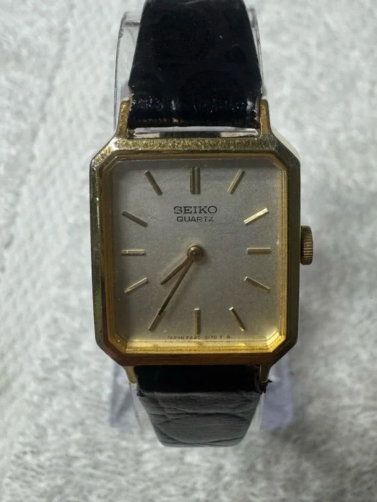 Seiko Gold Tone Square Watch with Silver Dial and Black Strap