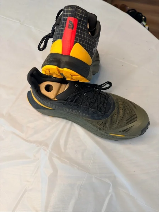 The North Face Men's Black and Olive Trail Shoes with Yellow and Red Accents
