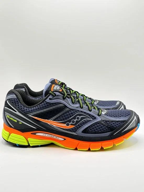 Saucony navy running shoes with orange & neon yellow accents