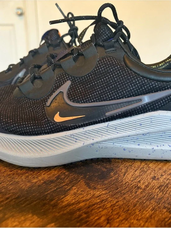 Nike Black Sneakers with Light Grey Sole and Gold Swoosh