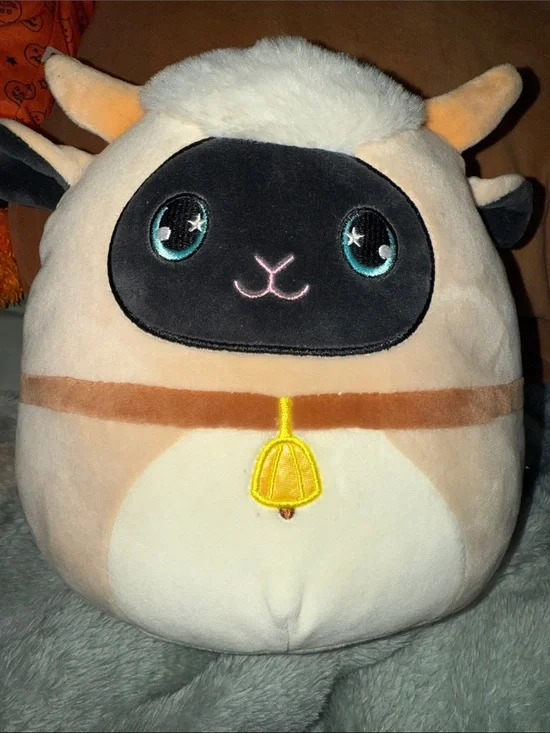 Squishmallows Cream & Black Sheep with Teal Eyes and Yellow Bell