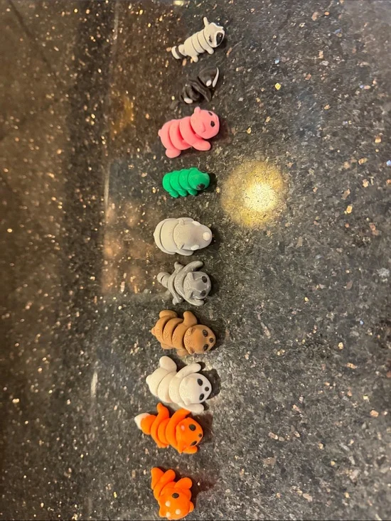 10 3d printed articulated and assorted animals.