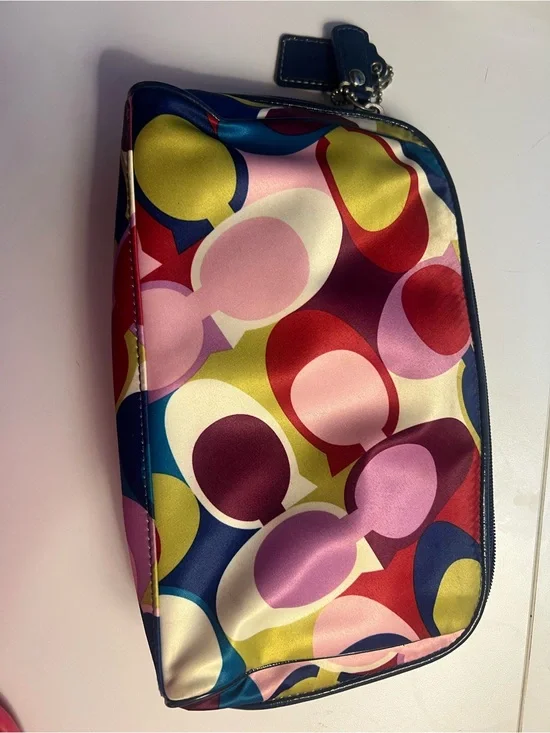 COACH multi color op art print satin cosmetic pouch.