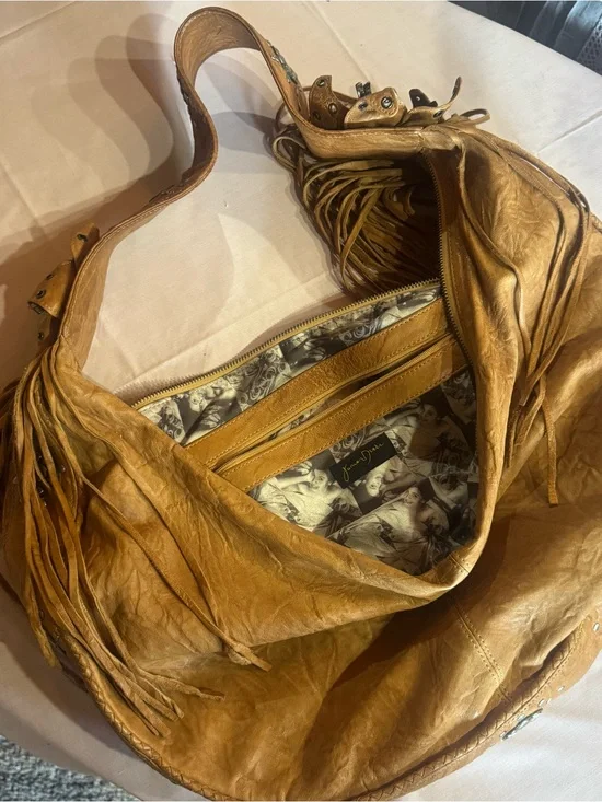 Junior Drake  studded and Fringed Leather Hobo Bag in light brown.  Western edge