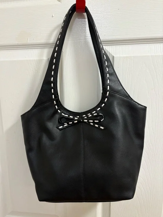 black hobo-style shoulder bag , measures 9 by 14 by 4 inches