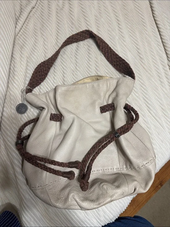 The Sak Cream Leather Drawstring Hobo with Brown Braided Straps