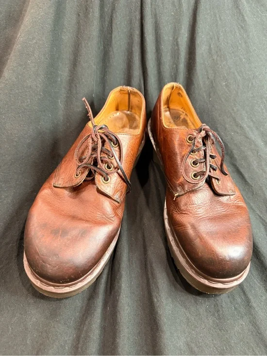 Vintage Dr. Martens Made in England (MIE) brown leather shoes.