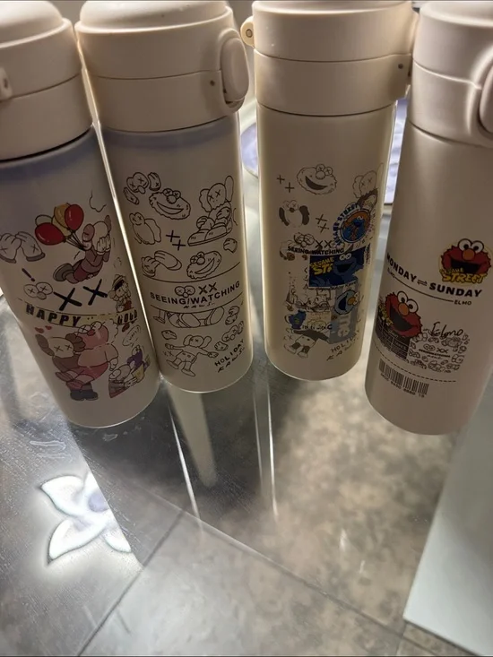 Four White Cartoon Stainless Kids Water Bottle - -Sesame Street