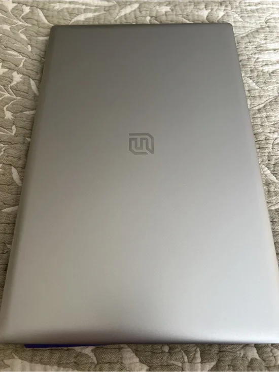 Silver Laptop with Minimal Logo - Modern Portable Computer