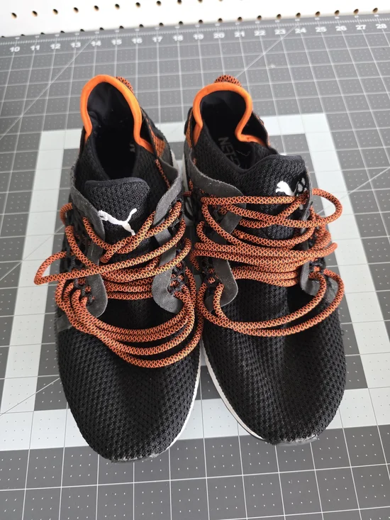 Puma Black Knit Sneakers with Orange Accents