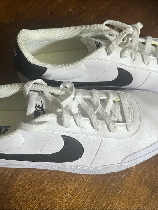 Nike White Sneakers with Black Swoosh Accent