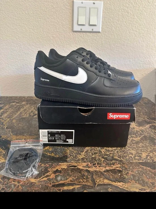 Nike Black Leather Low-Top Sneakers with White Swoosh