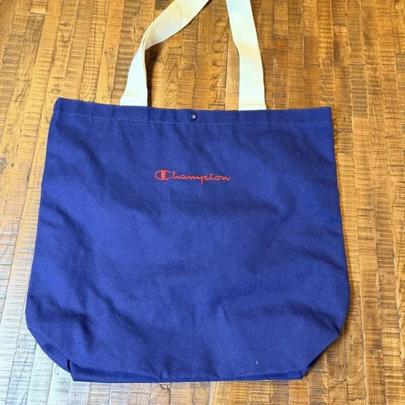Champion Navy Tote‎ Bag Embroidered Logo Snap Closure Interior Slip Pockets NWT