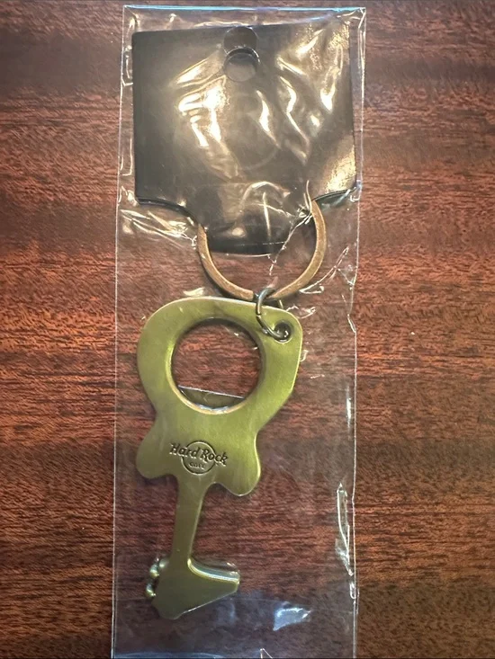 Hard Rock Cafe brass-toned key-shaped bottle opener keyring