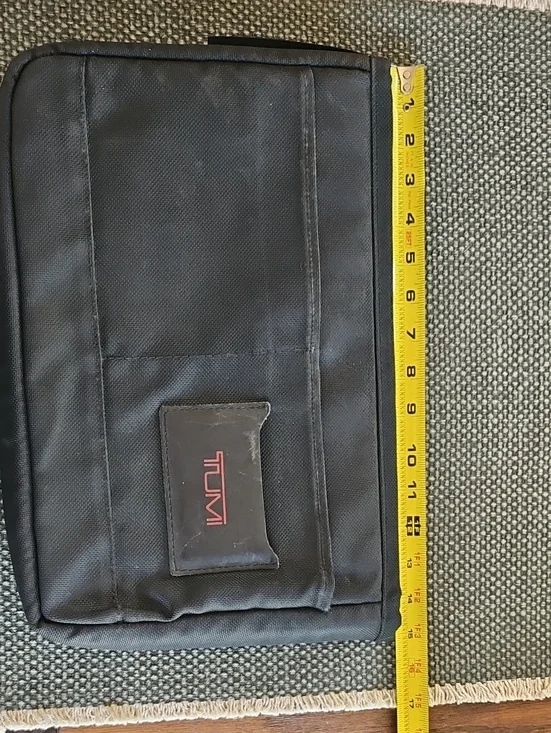 Tumi Black Laptop Sleeve with Red Logo Accent