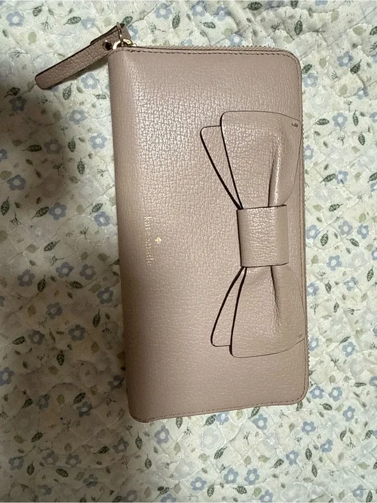 kate spade taupe bow zip-around wallet