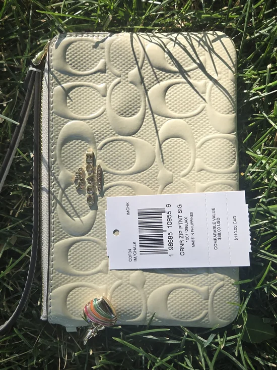 Coach Cream Signature Embossed Zip Wristlet with Gold Accents