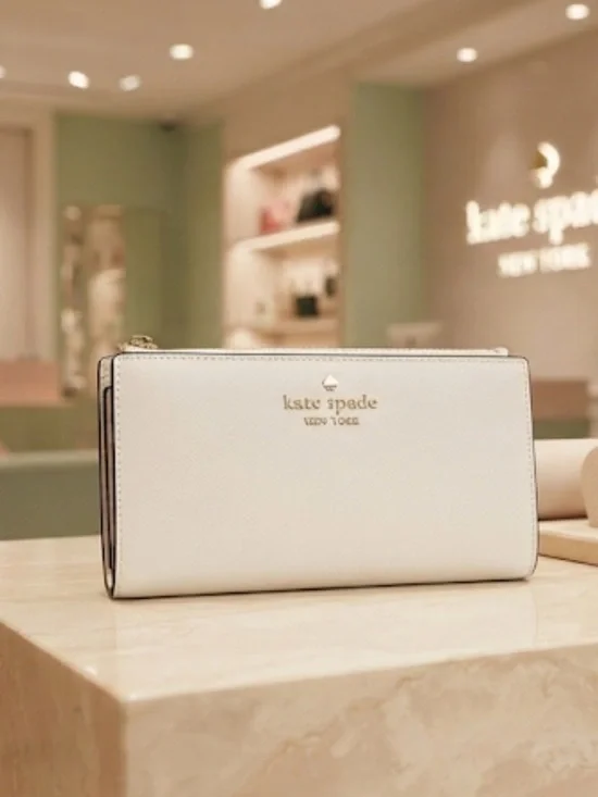 kate spade cream saffiano leather wallet with gold logo
