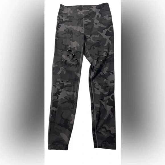 Zyia women’s 4 green camouflage leggings with distressed cut outs at knees