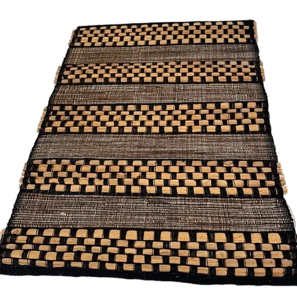 Set of 4 raffia woven placements in black and brown. Gently used.