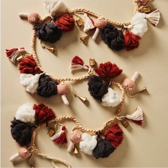 Anthropologie Festive Pom Garland with bells and mushrooms