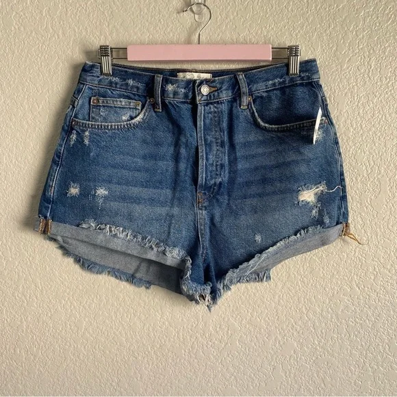 Free People Medium Wash Distressed Raw Hem Denim Shorts