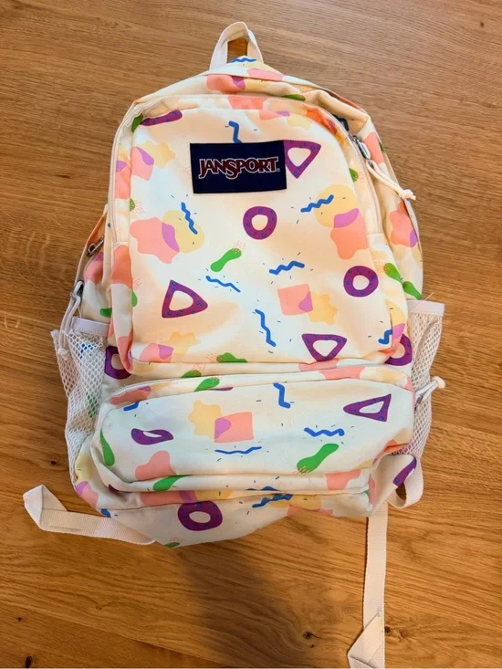 Jansport Cream Backpack with Pastel Pink, Purple & Green Shapes