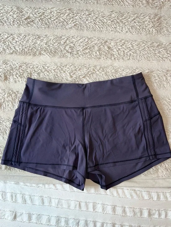 Like new Lululemon Women’s mid rise-Waist Purple Active Shorts