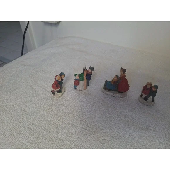 Vintage Style Christmas Village Figurines Set of4 Winter People Sledding Snowman