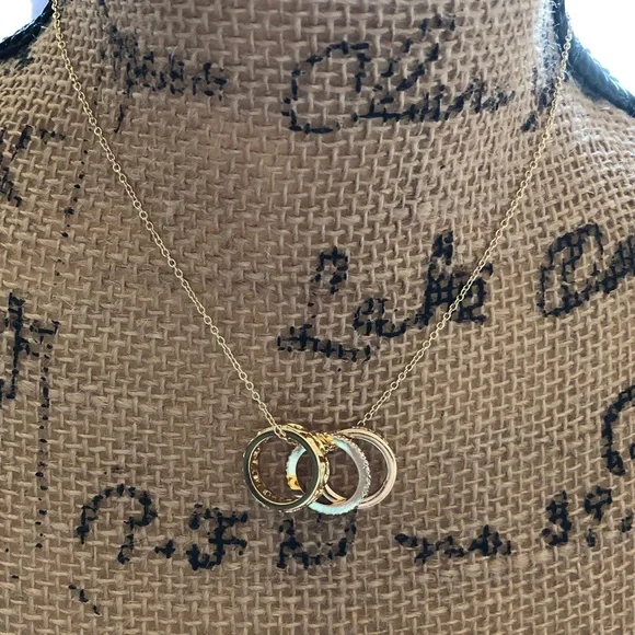 Authentic New on card. Coach Triple Gold Ring Necklace