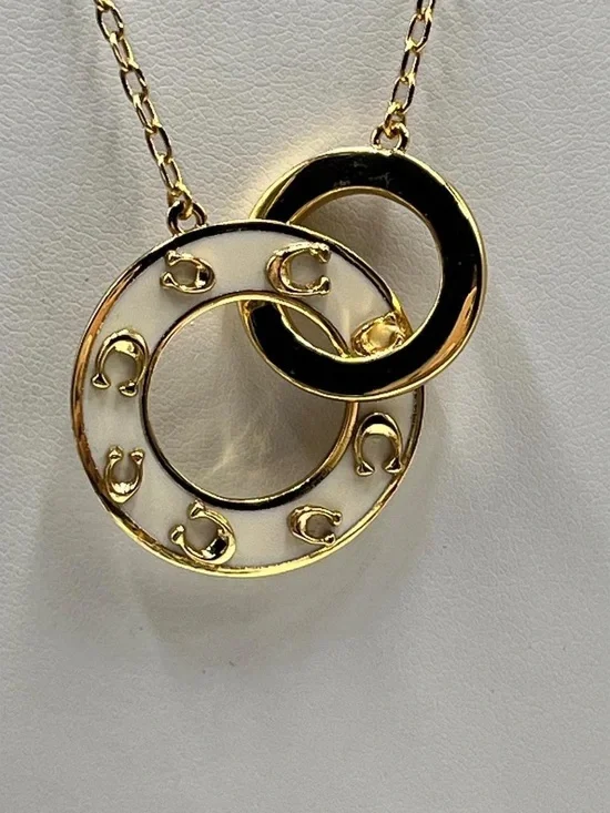 Coach Gold-Tone Interlocking Circle Necklace with Black and Cream Enamel