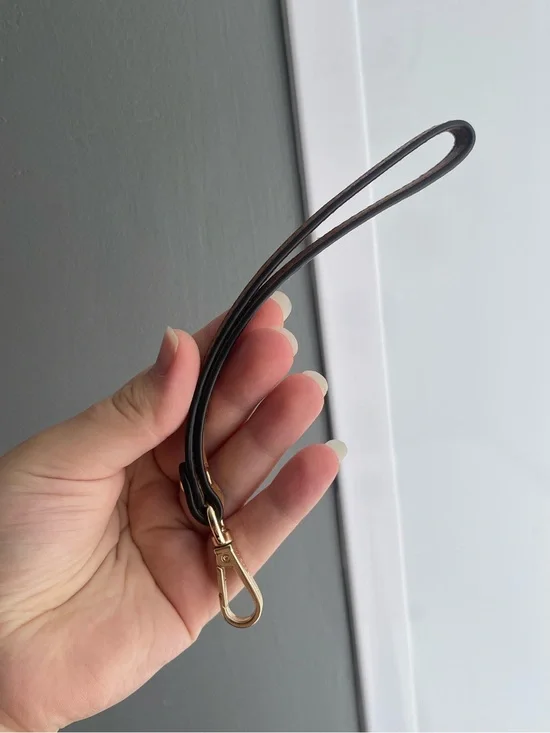 Brown Michael Kors wristlet strap