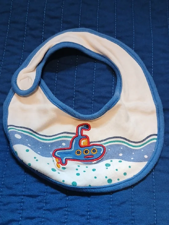 Bambini Cream Bib with Blue Trim and Submarine Applique