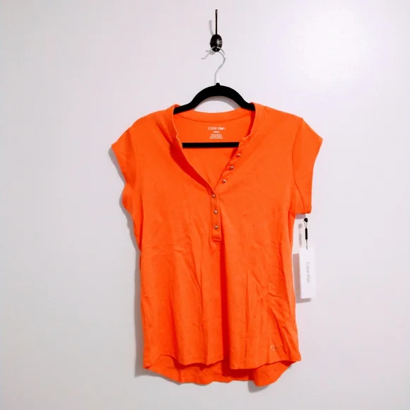 NWOT Calvin Klein orange short sleeve top with half button front detail.  Size