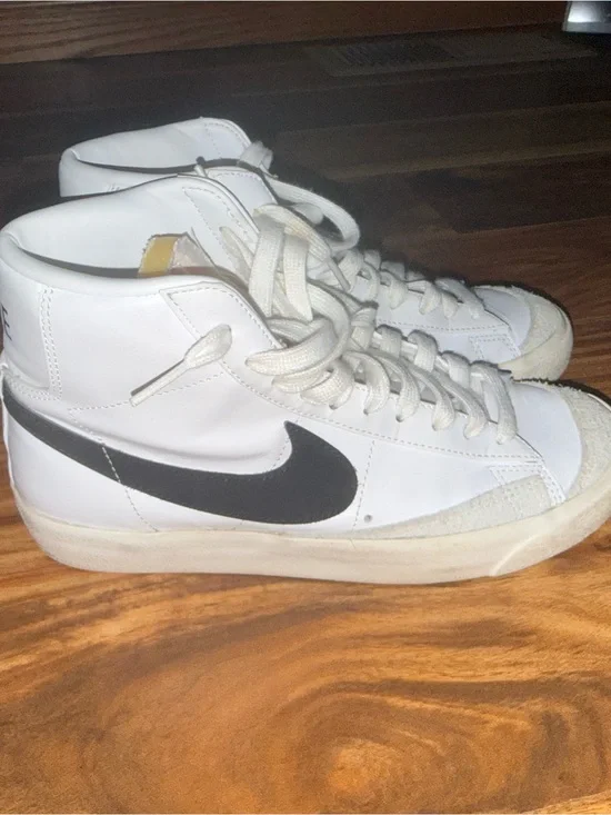 Nike White High-Top Sneakers with Black Swoosh