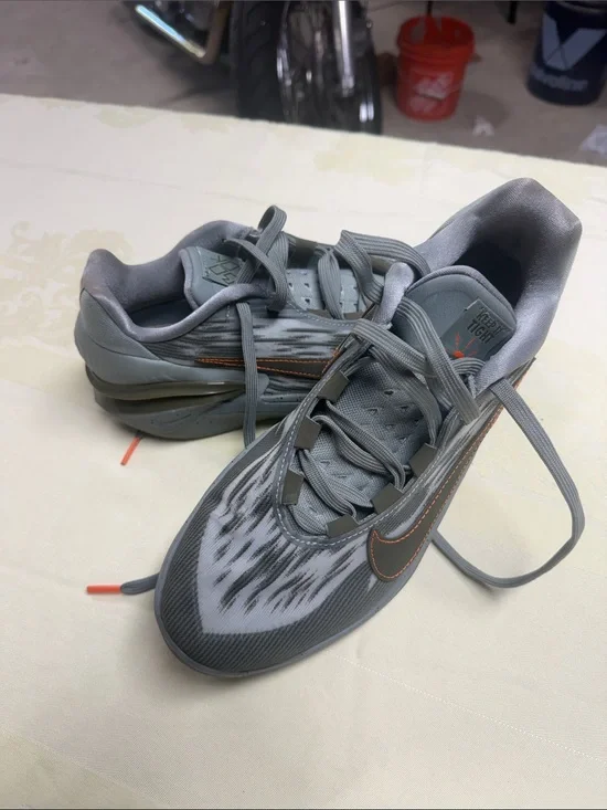 Nike Women’s Gray Sneakers with Orange Stitching