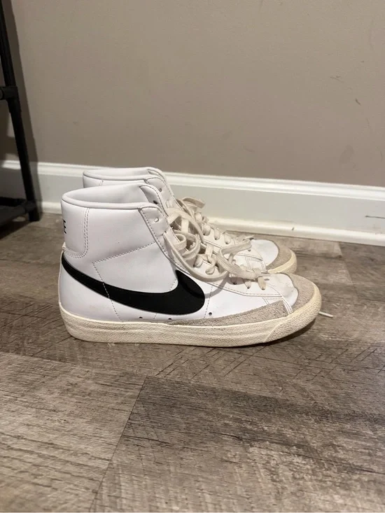 Nike High-Top Sneakers in White with Black Swoosh