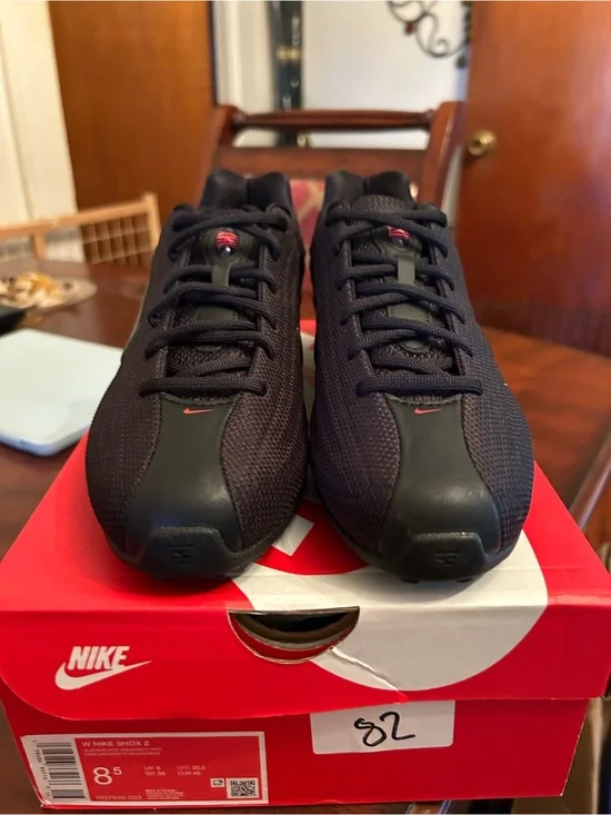 Nike Women’s Black Athletic Shoes with Red Accents