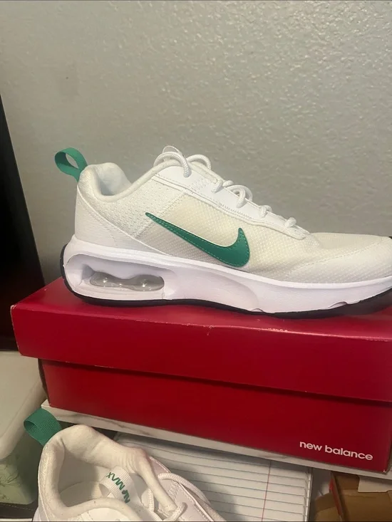 Ladies Nike White Running Shoes with Teal Swoosh