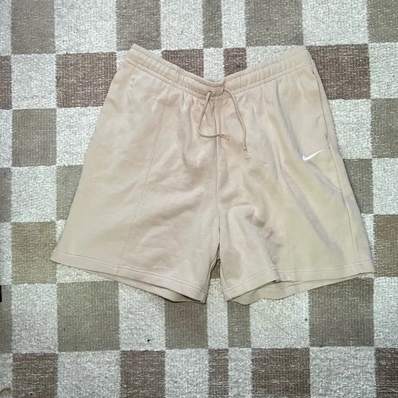 Nike Women's Beige Athletic Shorts with White Swoosh