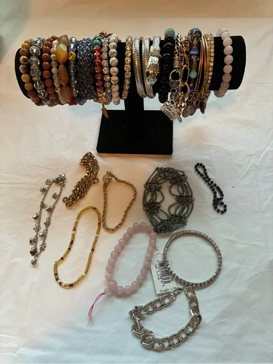 33 Vintage and modern bracelets. Some are stretchy and some aren’t.
