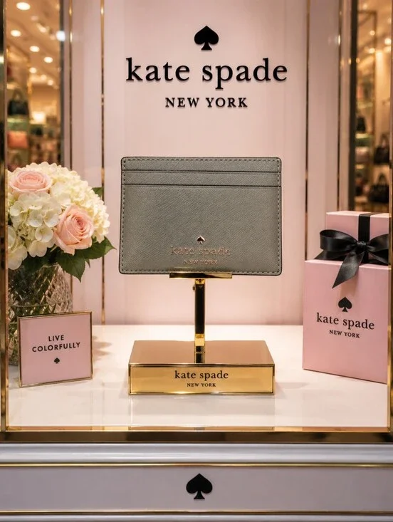 Kate Spade gray saffiano card holder with gold logo