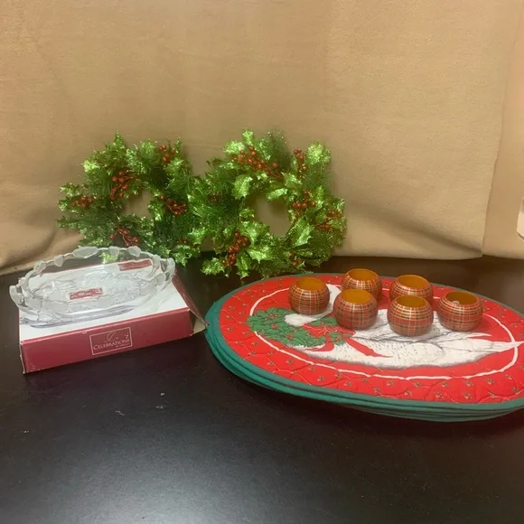 Holiday placemats, napkin rings, candle rings and carolers bowl which is new