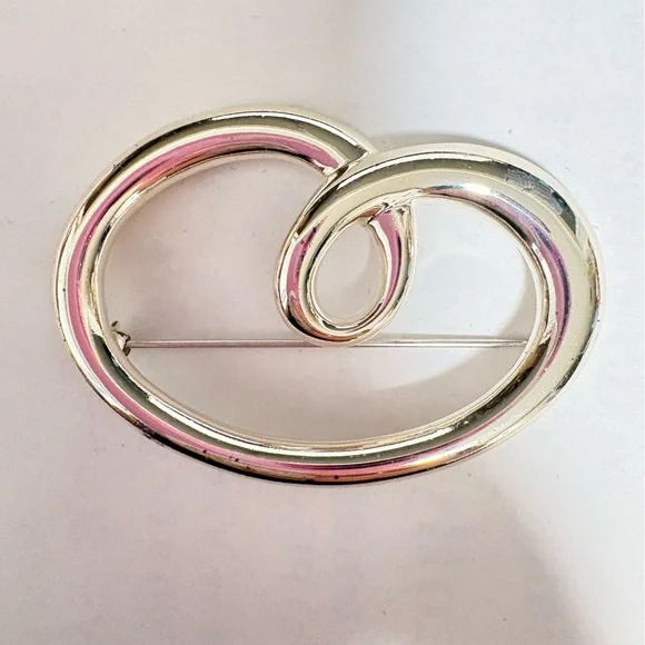 Vintage sign, Monet Silvertone heart shaped swirl Brooch